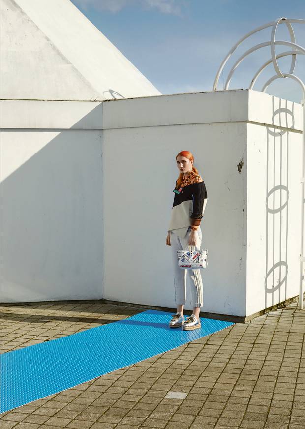 Prada top, $1,205 (U.S.), Prada jacket, $1,970 (U.S.) at Prada (www.prada.com). Triarchy jeans, $585 through www.atelierdenim.com. Prada shoes, $977, Kenzo bag, $941 at Nordstrom.