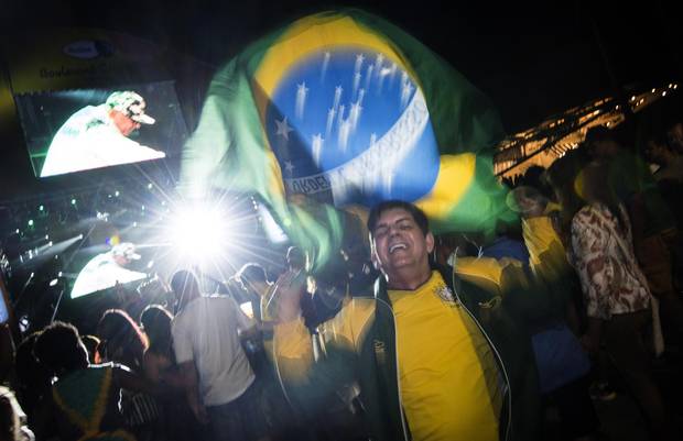 People dance to music on Olympic Boulevard in Rio’s old port district during the night of the Olympic opening ceremony on Friday, August 5, 2016.