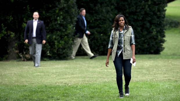 First lady Michelle Obama arrives for a harvesting event at White House Kitchen Garden on the South Lawn of the White House October 6, 2016 in Washington, DC.