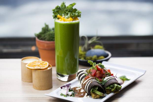 Enchiladas served with a Green Machine smoothie and kava.