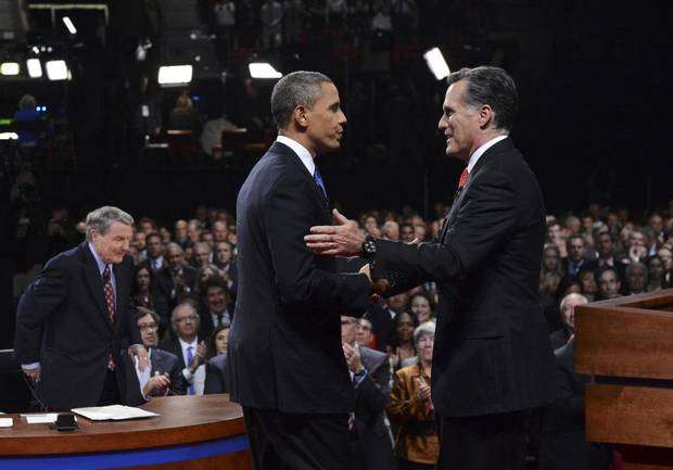 Republican presidential nominee Mitt Romney, right, shakes hands with President Barack Obama at the end of the first 2012 U.S. presidential debate in Denver, Oct. 3, 2012.