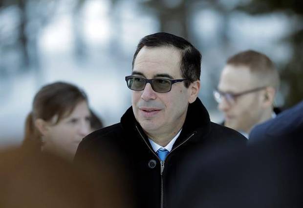 U.S. Treasury Secretary Steven Mnuchin walks through the snow during the annual meeting of the World Economic Forum in Davos, Switzerland, Wednesday, Jan. 24, 2018