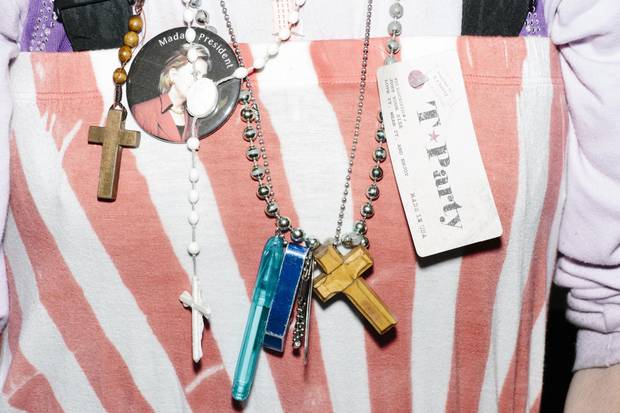 Terry Locke, an ordained minister of Concord, N.H., sits on the bleachers after Ms. Clinton’s Hooksett rally.