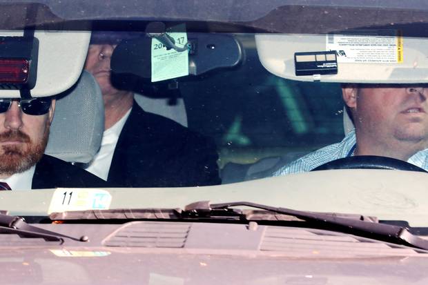 Oct. 30, 2017: Federal agents arrive with former Trump campaign manager Paul Manafort (back seat) in custody at the federal courthouse in Washington.