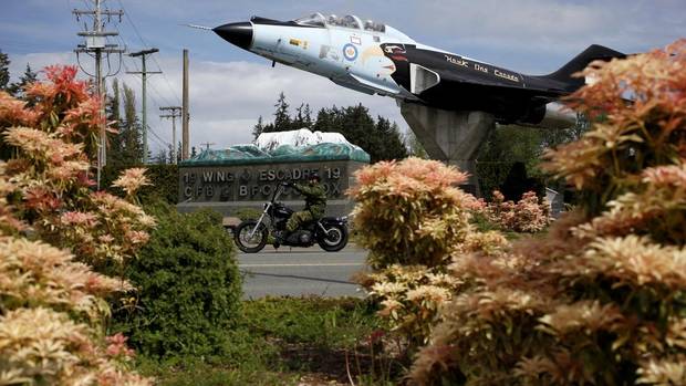 Military personnel rides by Canadian Forces Base Comox in the Vancouver Island riding of Courtenay-Comox.