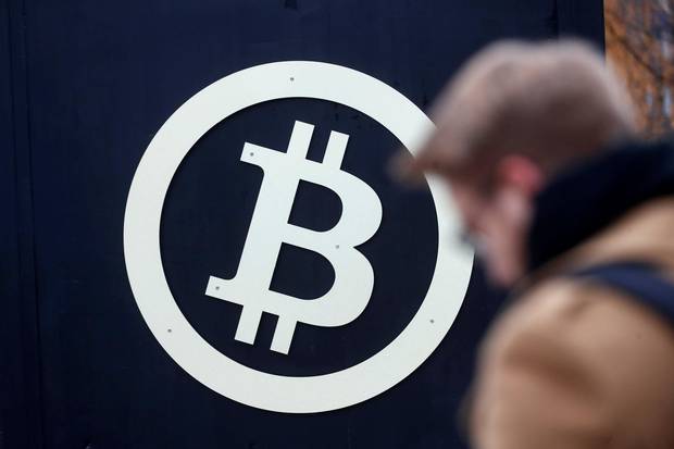 A bitcoin sign is seen during Riga Comm 2017, a business technology and innovation fair in Riga, Latvia on November 9, 2017.