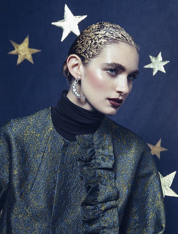 Coat, $850 at Comrags (www.comrags.com). Rebekah Price earrings, $125 through www.rebekahprice.com.