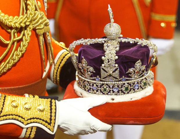 The Imperial State Crown is carried into Britain’s Parliament.