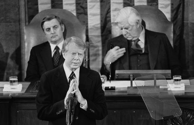 In this Jan. 19, 1978 file photo, President Jimmy Carter gestures as he delivers his State of the Union Address on Capitol Hill in Washington. Vice President Walter Mondale is seated left, House Speaker Thomas P. O'Neill is at right.
