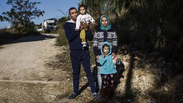 Iwan and Zamzam Dalaa pose with daughters Karima, 5, and Ayat, 1. The family fled their hometown of Sekeen in Idlib four and a half years ago.