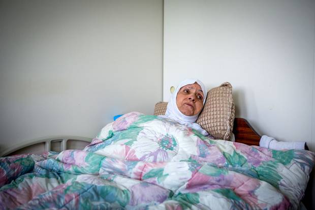 Mr. Sharbaji’s 90-year-old mother, Fakhira, has Alzheimer’s and needs constant attention. His role caring for her leaves him unable to work.