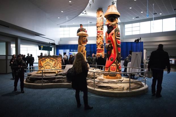 Cedar carvings by Reg Davidson, an acclaimed Haida artist, are displayed in the Link atrium area of Vancouver International Airport.