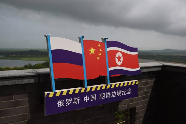 The flags of Russia, China and North Korea fly on a viewing tower on the border between the three countries in Hunchun, in China’s northeast Jilin province.