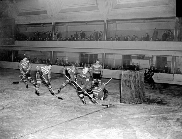 A varsity hockey match between The Oxford Dark Blues and Cambridge Light Blues, Feb. 22, 1957. The teams have been battling each other on the ice for more than 130 years'