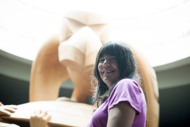 Nika Collison stands in front of Bill Reid’s iconic sculpture The Raven and The First Men.