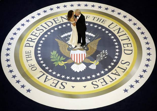 President Donald Trump dances with first lady Melania Trump, at The Salute To Our Armed Services Inaugural Ball in Washington, Friday, Jan. 20, 2017.