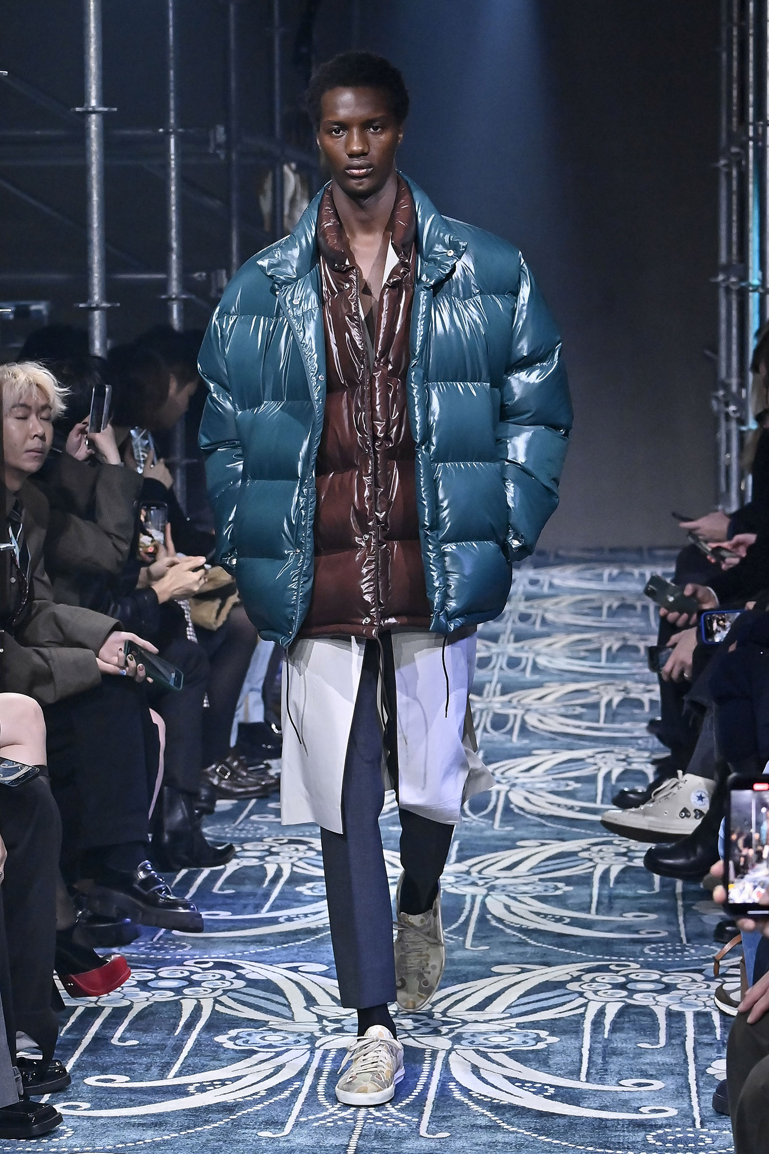 MILAN, ITALY - JANUARY 19: A model walks the runway during the Prada Ready to Wear Fall/Winter 2025-2026 show as part of the Milan Men Fashion Week on January 19, 2025 in Milan, Italy. (Photo by Victor VIRGILE/Gamma-Rapho via Getty Images)