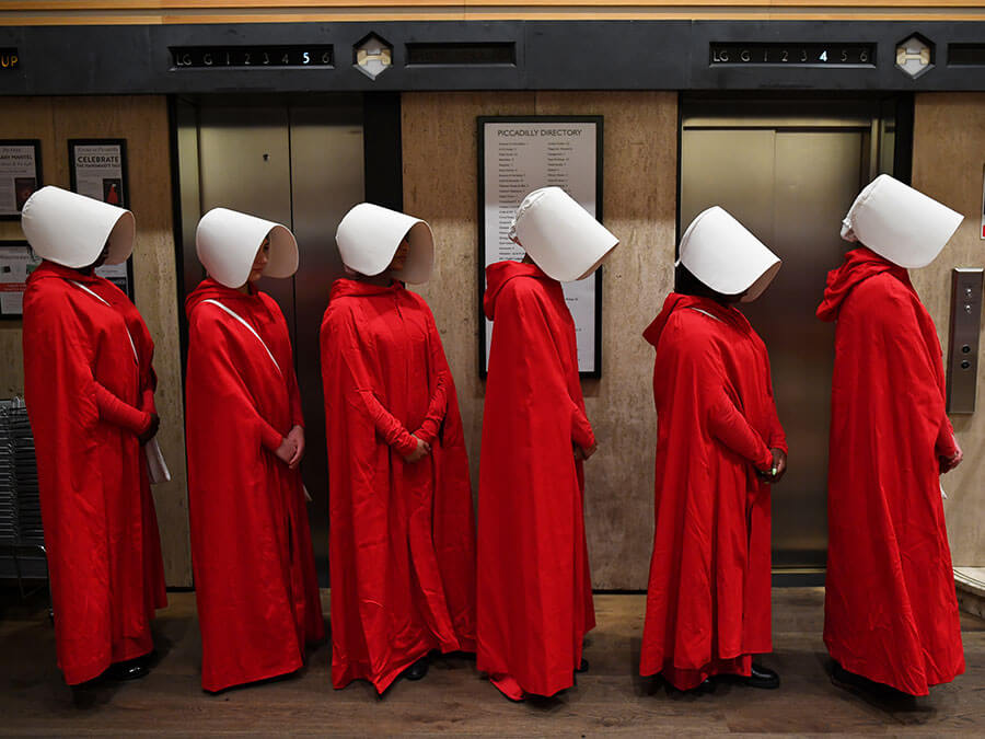 People dressed as handmaids for the launch of The Testaments