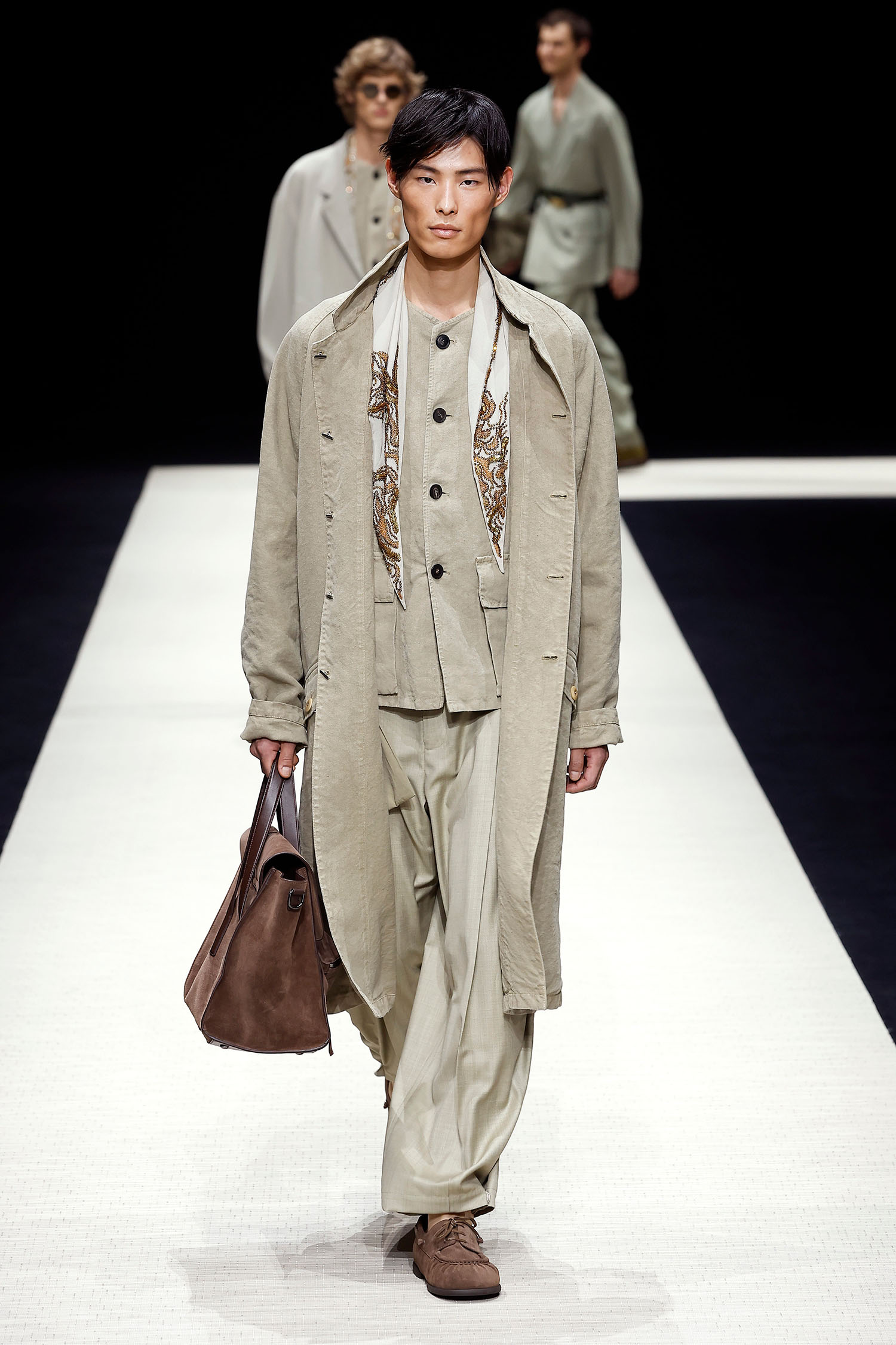 MILAN, ITALY - JUNE 15: A model walks the runway at the Emporio Armani fashion show during the Milan Menswear Spring/Summer 2025 on June 15, 2024 in Milan, Italy. (Photo by Estrop/Getty Images)