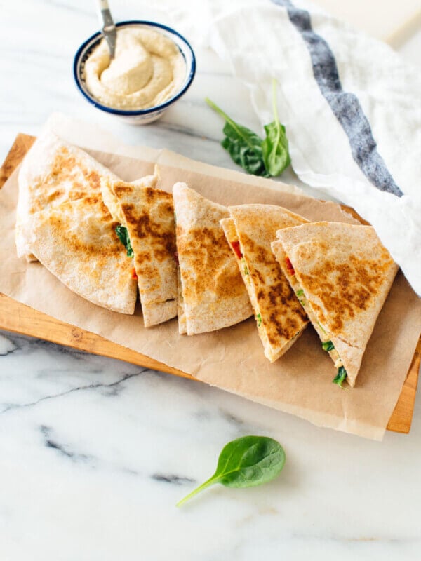 This hummus quesadilla recipe is simple, quick and healthy, too! Dairy-free and vegan (also gluten-free if you use gluten-free tortillas). Get the recipe at cookieandkate.com