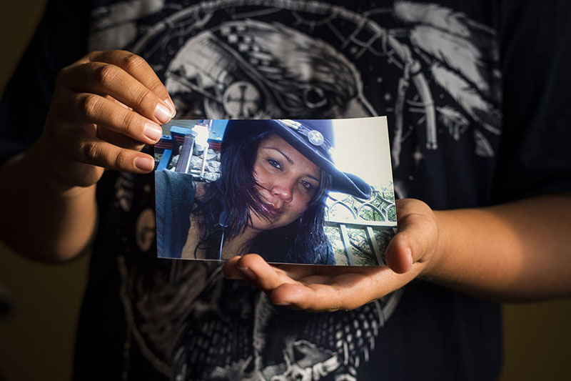 Darryl Stauffer, Jr., holds a photograph of his mother. The last time he saw her was April, 2011. (John Lehmann/The Globe and Mail)