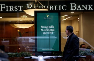 FILE PHOTO: A person walks past a First Republic Bank branch in Midtown Manhattan in New York City, New York, U.S., March 13, 2023. REUTERS/Mike Segar/File Photo
