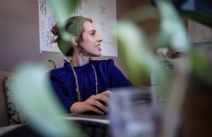 When Heather Aleinik was laid off from Shopify Inc. last summer, it was "one of the biggest curveballs" of her career. Aleinik works remotely from her home office in Calgary, Friday, Sept. 1, 2023.THE CANADIAN PRESS/Jeff McIntosh