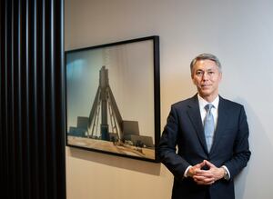 Mike Henry, CEO of Australian mining company BHP, standing beside a photograph of the company’s Jansen potash project, located in Saskatchewan, Canada, is photographed  on Oct 17, 2023. (Fred Lum/The Globe and Mail)