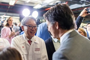 Honda CEO Toshihiro Mibe shakes hands with Prime Minister Justin Trudeau after Honda announced plans to build electric vehicles and their parts in Ontario with financial support from the Canadian and provincial governments, at the company's automotive assembly plant in Alliston, Ontario, Canada, April 25, 2024.  REUTERS/Carlos Osorio