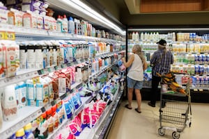 People shop inside a Metro grocery store in Toronto, Tuesday, July 18.