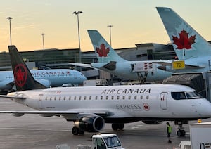 Air Canada planes are seen at the gates at Montréal-Pierre Elliott Trudeau International Airport in Dorval, Quebec on April 2.