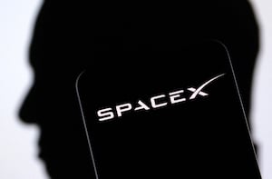 SpaceX logo and Elon Musk silhouette are seen in this illustration taken, December 19, 2022.