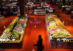 People shop in the produce area at a Loblaws store in Toronto on May 3, 2018.