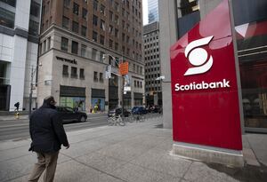 A large sign for Scotiabank stands on the sidewalk at Queen St. West and Bay St. on April 12, 2022. Fred Lum/The Globe and Mail.