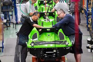 Employees work on the SeaDoo assembly line at the BRP plant on June 12, 2014 in Valcourt, Que.