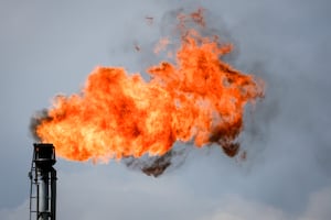 A flare stack burns off excess gas at a processing facility near Crossfield, Alta., Tuesday, June 13, 2023. Most Albertans would support some kind of national cap on carbon emissions from the oil and gas sector, two new polls suggest. THE CANADIAN PRESS/Jeff McIntosh