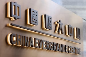 FILE PHOTO: The China Evergrande Centre building sign is seen in Hong Kong, China December 7, 2021. REUTERS/Tyrone Siu/File Photo