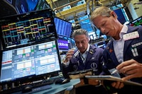 Traders work on the floor at the New York Stock Exchange (NYSE) in New York City, U.S., June 3.
