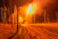 In this image made from video provided by Russian Defense Ministry Press Service on Tuesday, June 30, 2026, Russian TOS-1 Solntsepyok heavy flamethrower rocket launcher fires towards the Ukrainian positions. (Russian Defense Ministry Press Service via AP)
