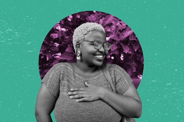 Photo illustration of a Black woman with short hair and wearing glasses smiling with a hand on her chest.