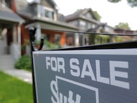 FILE PHOTO: A sign advertises a house for sale on a residential street in midtown Toronto, Ontario, Canada July 12, 2017.  REUTERS/Chris Helgren/File Photo