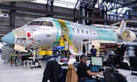 Bombardier employees work on an aircraft in Dorval, Quebec on Monday, April 14, 2025.   