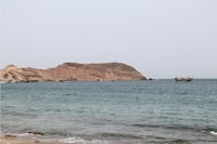 A photo taken from the Yemeni coast southwest of the city of Taiz, shows boats floating at Bab al-Mandab Strait, in the Red Sea, on July 24, 2026. A Houthi spokesman said on July 24, that the rebels were not blocking traffic through the strategic Bab al-Mandeb Strait, after they declared a maritime embargo this week on their foe Saudi Arabia. (Photo by Khaled ZIAD / AFP via Getty Images)