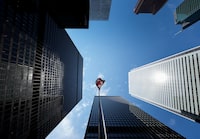 The Bay Street Financial District is shown with the Canadian flag in Toronto on Friday, Aug. 5, 2022.THE CANADIAN PRESS/Nathan Denette