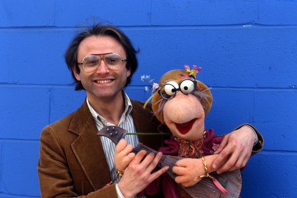 Fraggle Rock behind the scenes, on set. Songwriter Phil Balsam with Phil Fraggle.  Courtesy of The Jim Henson Company