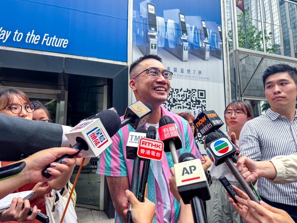 Trans activist Henry Tse speaks to the media after receiving his new Hong Kong ID card with gender listed as male on Monday, April 29, 2024.