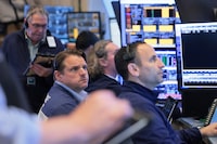 NEW YORK, NEW YORK - APRIL 20: Traders work on the floor of the New York Stock Exchange during morning trading on April 20, 2026 in New York City. Stocks opened up mixed as investors continue to monitor the U.S. war with Iran after an escalation over the weekend due to the seizure of an Iranian-flagged cargo ship. (Photo by Michael M. Santiago/Getty Images)