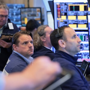 NEW YORK, NEW YORK - APRIL 20: Traders work on the floor of the New York Stock Exchange during morning trading on April 20, 2026 in New York City. Stocks opened up mixed as investors continue to monitor the U.S. war with Iran after an escalation over the weekend due to the seizure of an Iranian-flagged cargo ship. (Photo by Michael M. Santiago/Getty Images)
