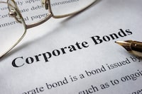 Page of newspaper with words corporate bonds. Trading concept.