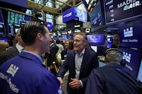 Madison Industries CEO Larry Gies talks with traders at the New York Stock Exchange (NYSE) to celebrate the company’s initial public offering in New York City, U.S., April 16, 2026. REUTERS/Jeenah Moon
